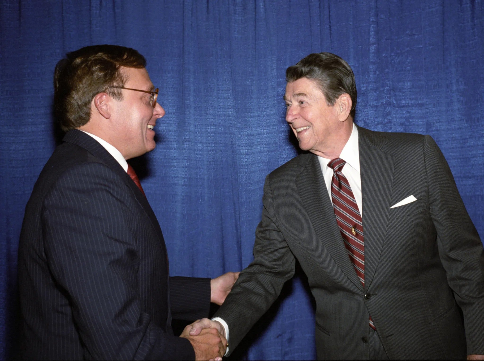President Ronald Reagan shaking Ed Feulner's hand