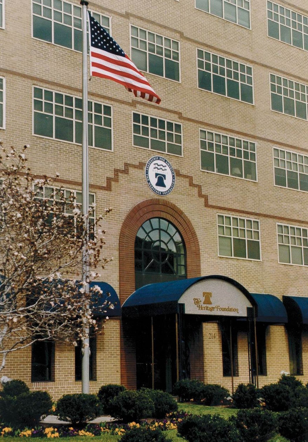 Entrance of Heritage building with American flag.
