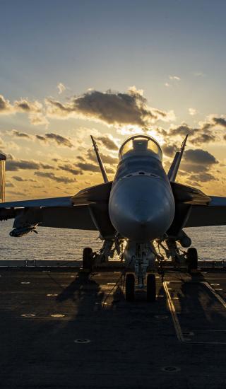 An F/A-18E Super Hornet attached to the "Gunslingers" of Strike Fighter Squadron (VFA) 105 sits on the flight deck aboard the Nimitz-class aircraft carrier USS Dwight D. Eisenhower (CVN 69) in the Mediterranean Sea, March 26, 2021. 