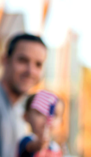 Young Boy Waiving American Flag