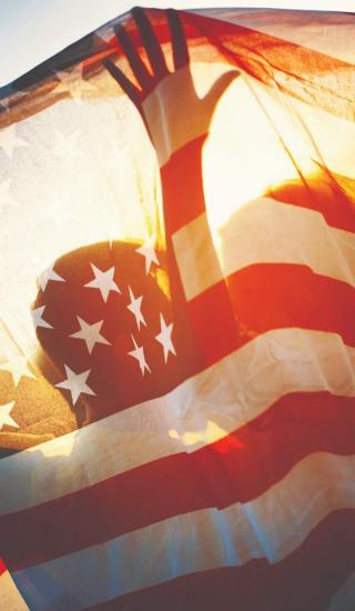 people holding the American flag